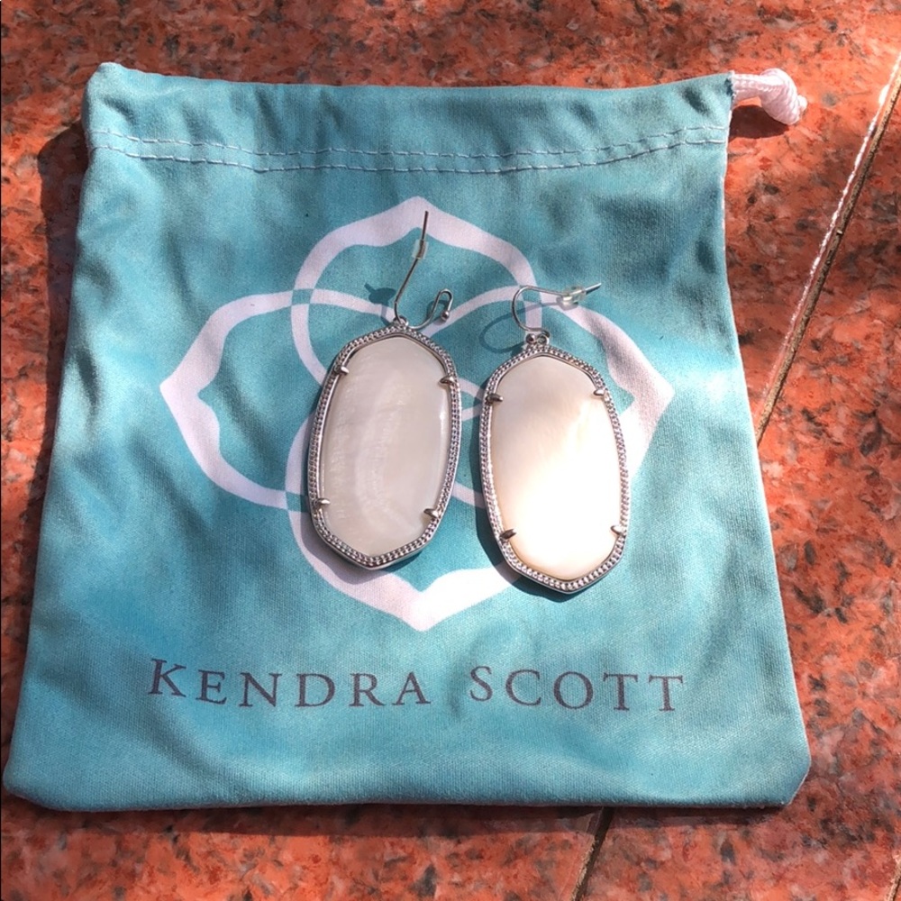 Kendra Scott White with silver earrings